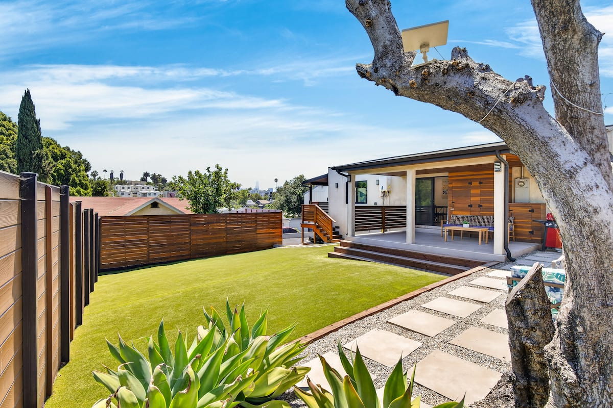 Gated backyard with lawn and deck, Silver Lake home