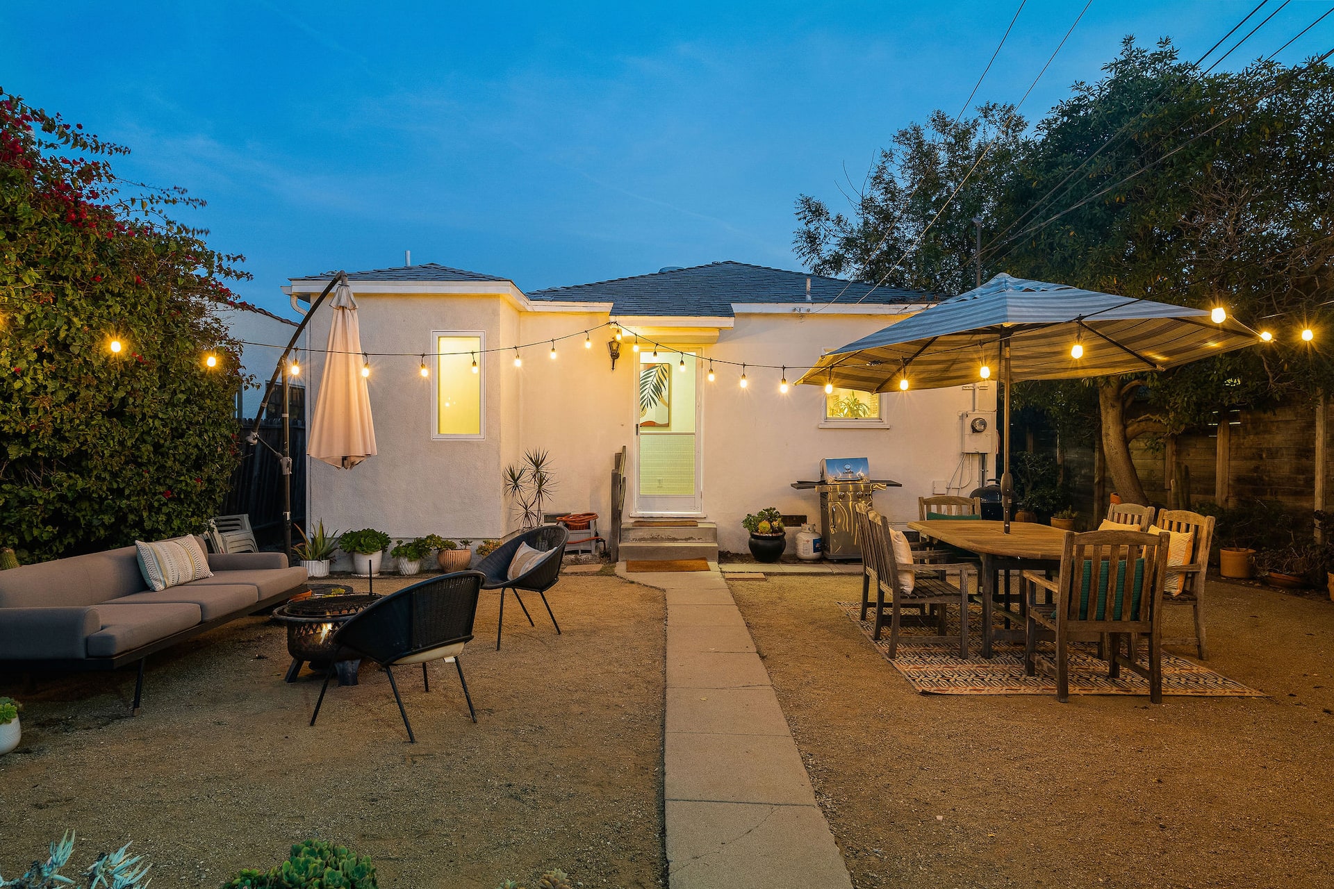 Venice bungalow and backyard with string lights at dusk